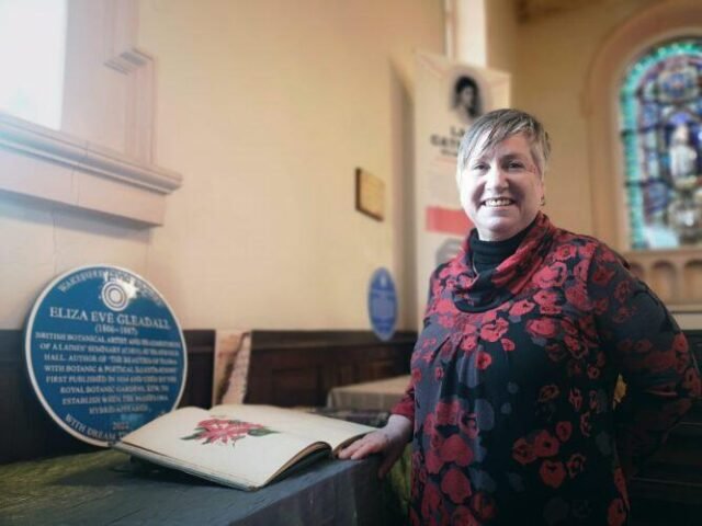 Researcher Helga Fox with Eliza Gleadall's Blue Plaque