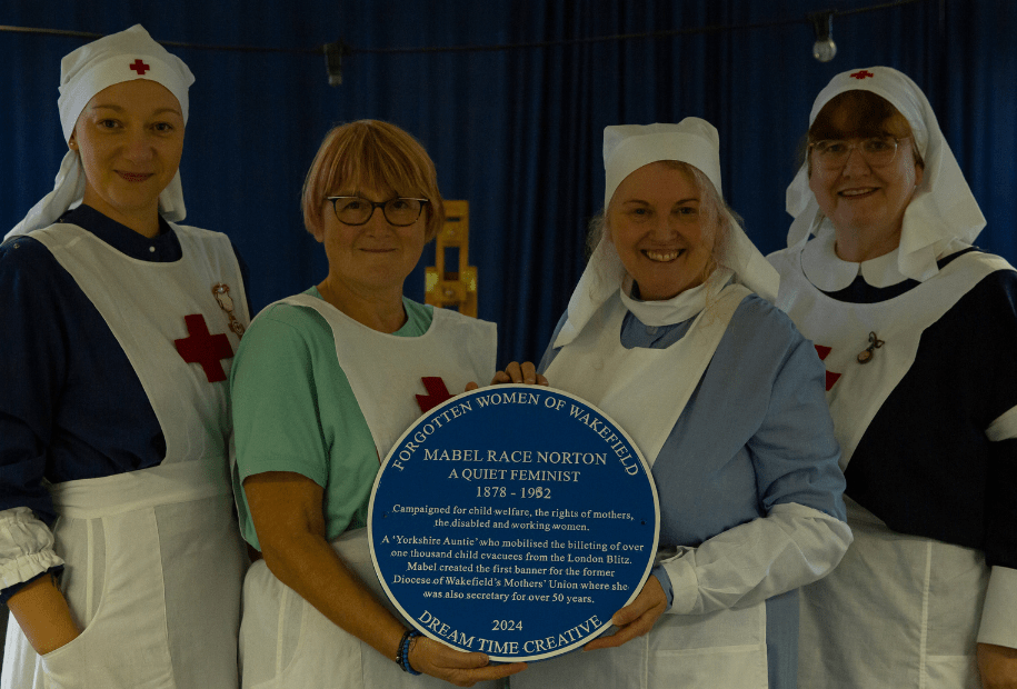 The Round our Way team in WW1 VAD Costume with Mael Norton's Blue Plaque