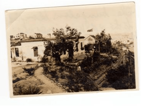 Photograph of the McPherson family bungalow on Cheung Chau Island, Hong Kong, with handwritten caption by Gertrude McPherson on the reverse