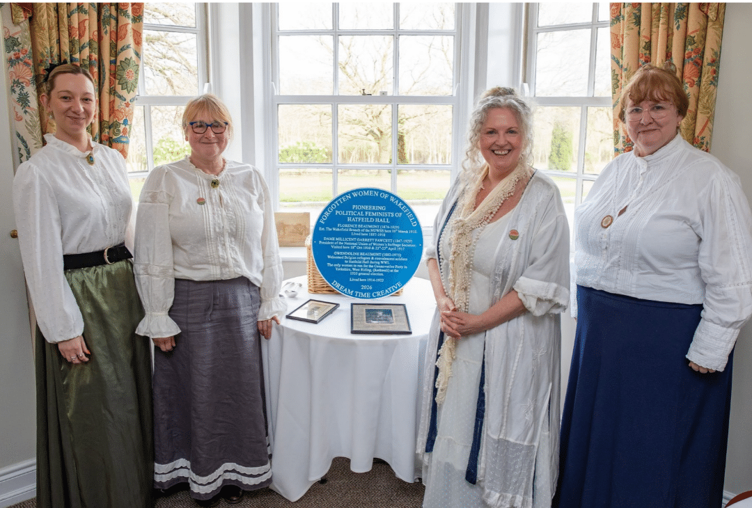 Forgotten Women of Wakefield Team display blue plaque celebrating the centenary of equal voting for men and women