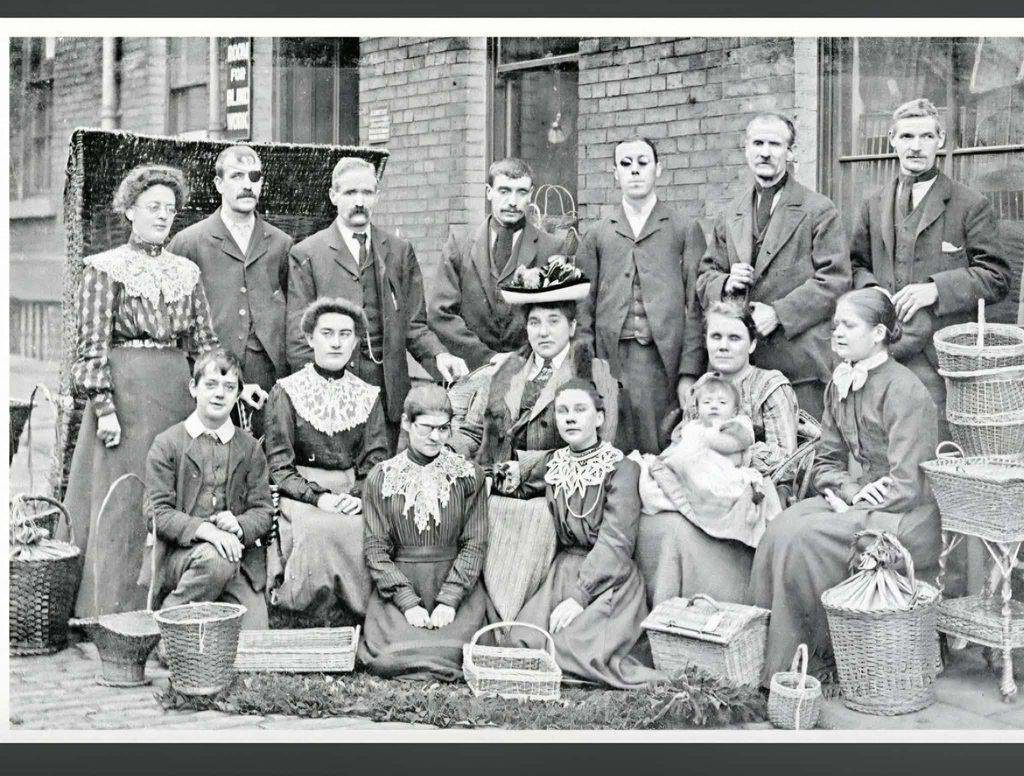 Historic group photograph outside a building used by the Wakefield Blind Society.